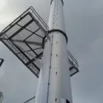 Steel platform attached to large steel chimney