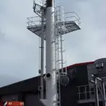 Steel chimney with platform and covered ladders